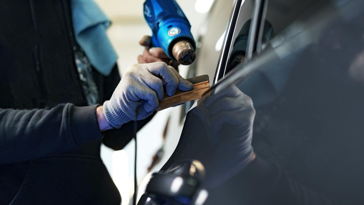 44410974 close up of male car service worker applying nano coating on a car