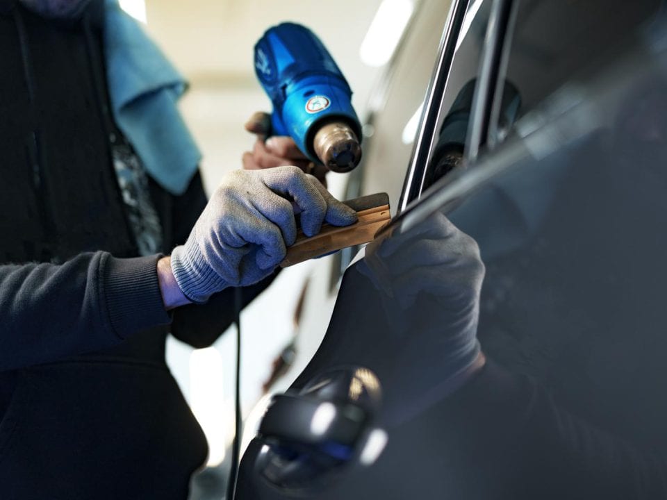 44410974 close up of male car service worker applying nano coating on a car