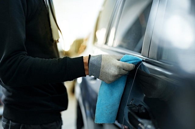 44412090 close up of male car service worker applying nano coating on a car